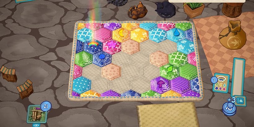 A partially finished quilt with a rainbow button in the upper left corner